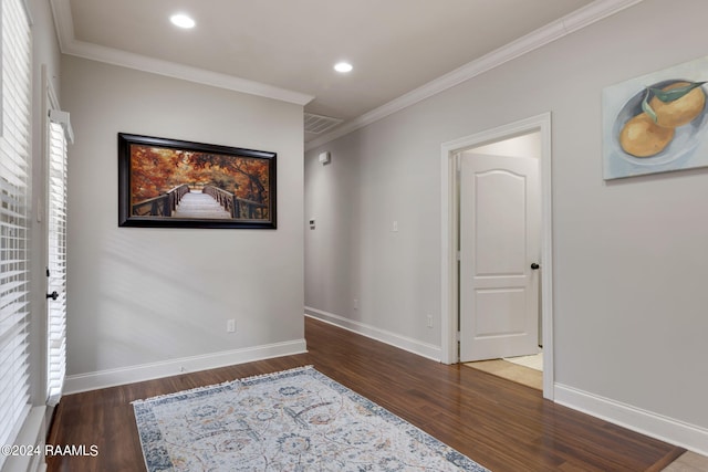 unfurnished room with crown molding and dark hardwood / wood-style floors