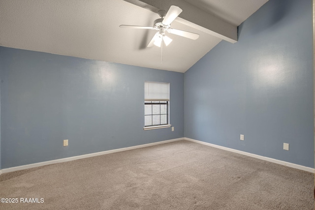 carpeted spare room with vaulted ceiling with beams and ceiling fan