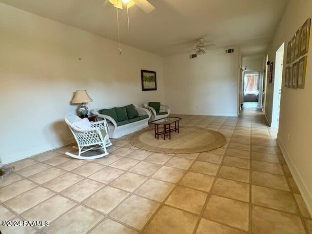 tiled living room with ceiling fan