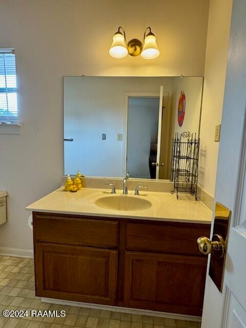 bathroom with vanity and tile patterned flooring