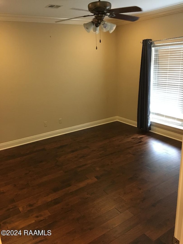 unfurnished room with ornamental molding, ceiling fan, and dark hardwood / wood-style flooring