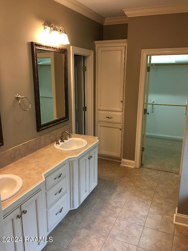 bathroom with crown molding and vanity