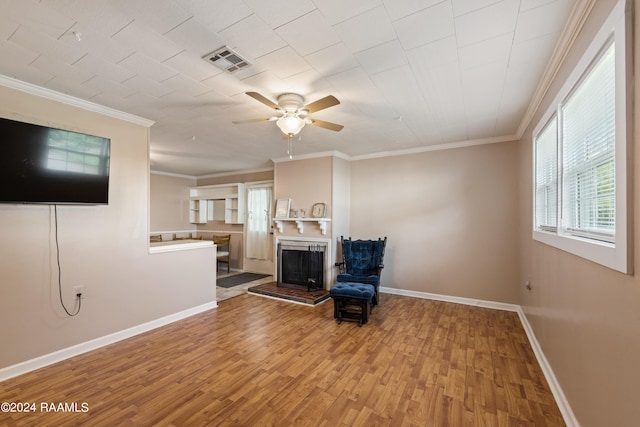 interior space with crown molding, light hardwood / wood-style flooring, and ceiling fan