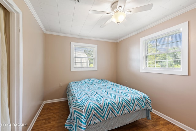 bedroom with ceiling fan, hardwood / wood-style floors, and crown molding