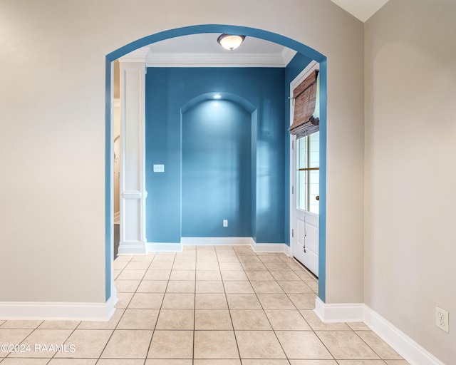 interior space featuring ornamental molding and light tile patterned floors