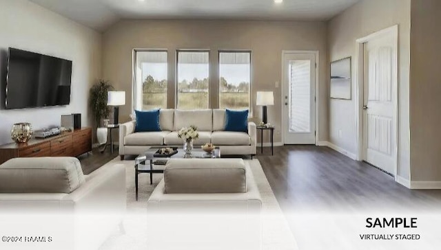 living room with wood finished floors and baseboards