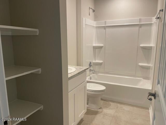 bathroom featuring vanity, toilet, and shower / bathtub combination