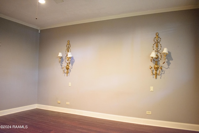 unfurnished room featuring hardwood / wood-style floors and crown molding