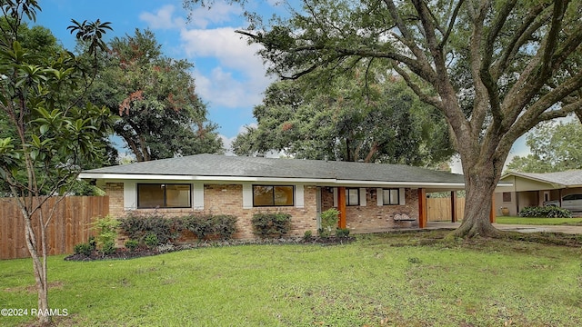 ranch-style home with a front lawn