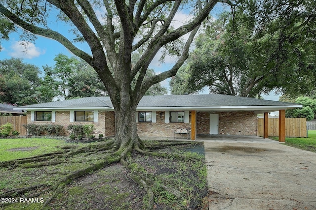 single story home with a carport