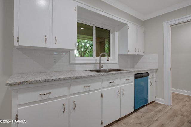 kitchen with white cabinets, sink, backsplash, light hardwood / wood-style floors, and stainless steel dishwasher