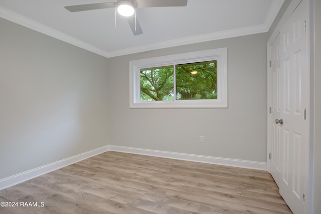 unfurnished room with crown molding, light hardwood / wood-style flooring, and ceiling fan