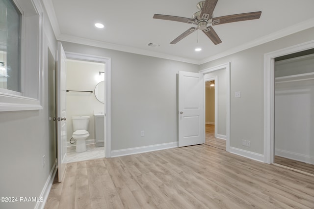 unfurnished bedroom with crown molding and light hardwood / wood-style flooring