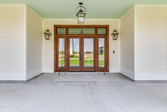 view of exterior entry featuring french doors