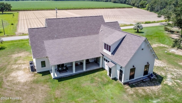 birds eye view of property with a rural view