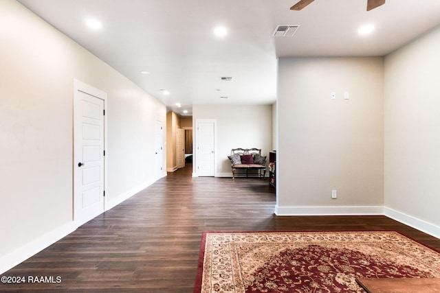 interior space with visible vents, baseboards, ceiling fan, dark wood finished floors, and recessed lighting