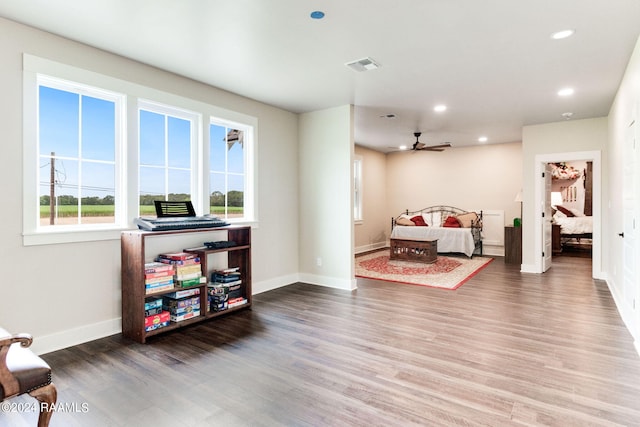 interior space with visible vents, recessed lighting, baseboards, and wood finished floors