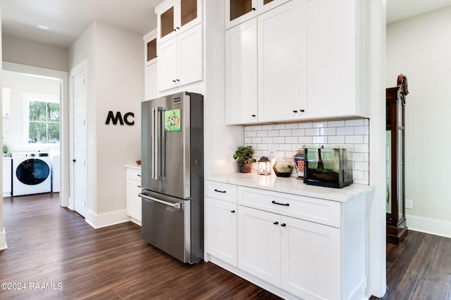 kitchen featuring backsplash, dark wood-type flooring, high end refrigerator, and light countertops