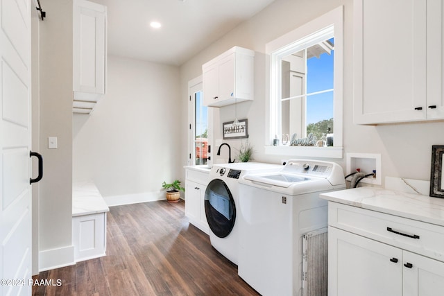 laundry area with washing machine and dryer, dark wood finished floors, recessed lighting, cabinet space, and baseboards