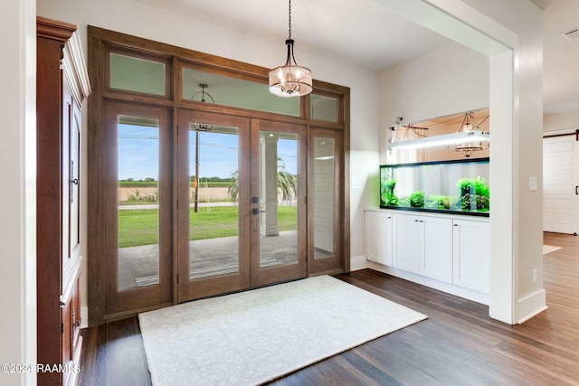 entryway featuring french doors, baseboards, and dark wood finished floors