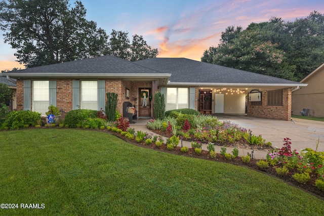 ranch-style home featuring a lawn