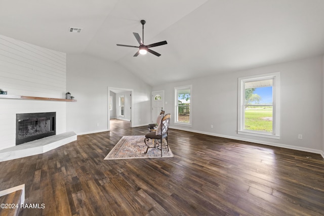 unfurnished living room with ceiling fan, dark hardwood / wood-style flooring, and lofted ceiling