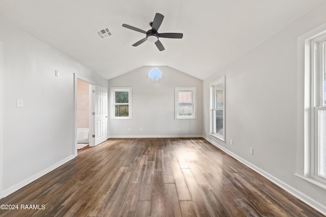 unfurnished room featuring ceiling fan, dark wood-type flooring, and lofted ceiling