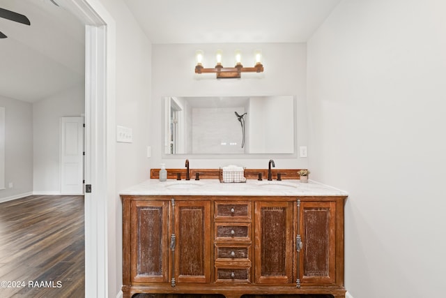 bathroom with ceiling fan, hardwood / wood-style floors, and vanity