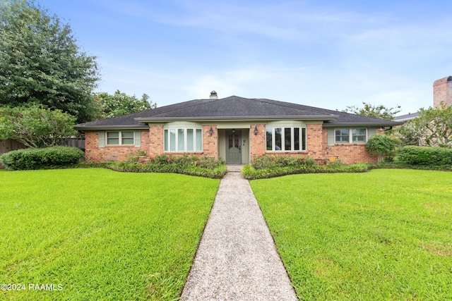 ranch-style house with a front yard