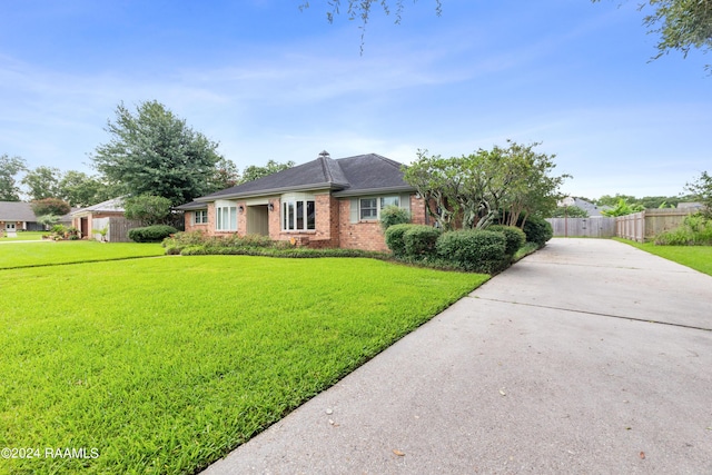 ranch-style house with a front yard