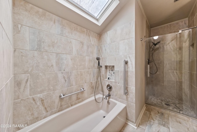 bathroom with vaulted ceiling with skylight