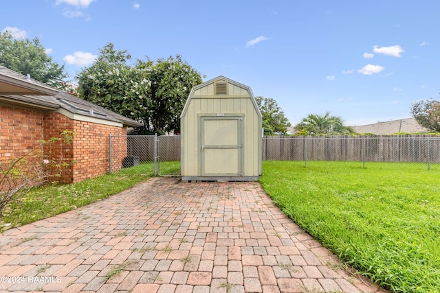 view of outbuilding featuring a lawn