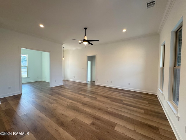 unfurnished room featuring crown molding, ceiling fan, and dark hardwood / wood-style flooring