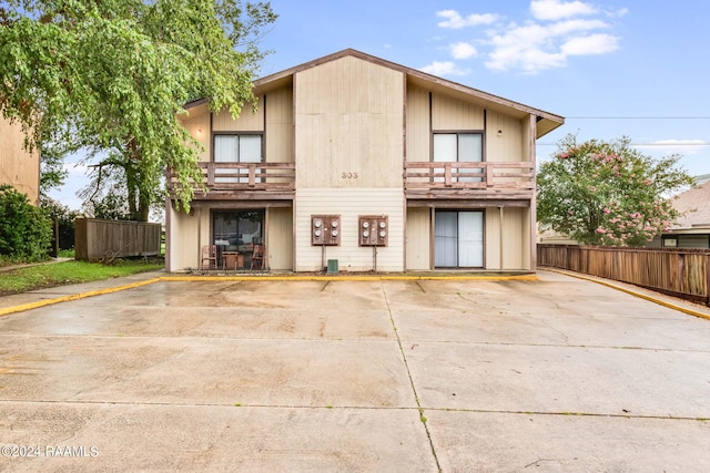 view of front of property with a balcony