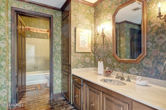 bathroom featuring vanity, a bath, ornamental molding, and toilet