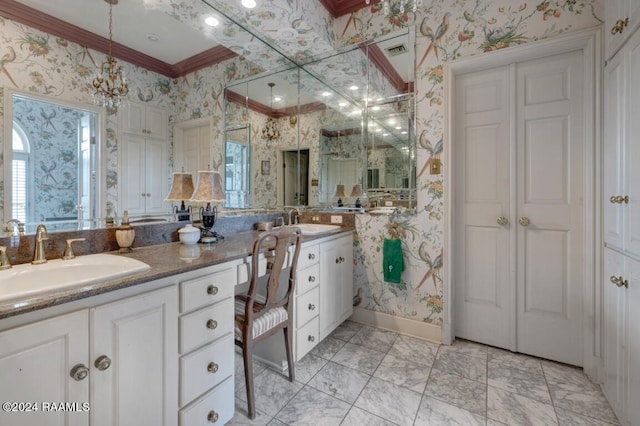 bathroom featuring vanity, a wealth of natural light, and ornamental molding