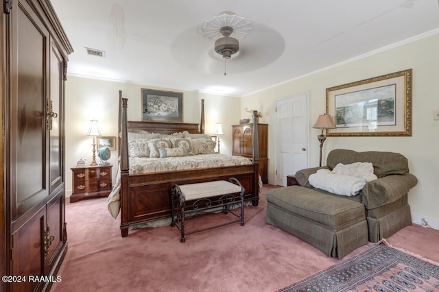 carpeted bedroom with crown molding and ceiling fan