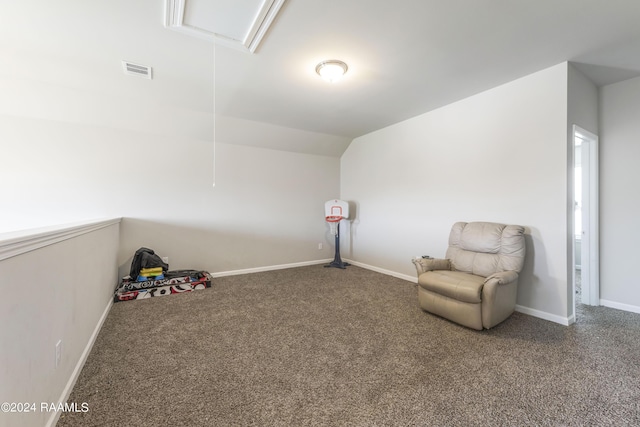 living area featuring lofted ceiling and carpet flooring