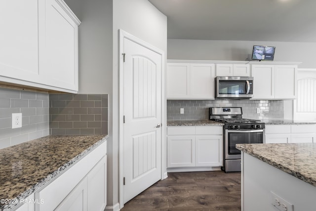 kitchen featuring white cabinets, dark wood-type flooring, stainless steel appliances, and stone countertops