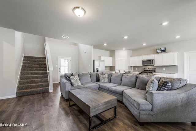 living room with dark hardwood / wood-style flooring