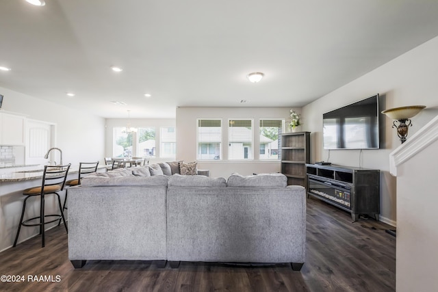 living room with dark hardwood / wood-style flooring