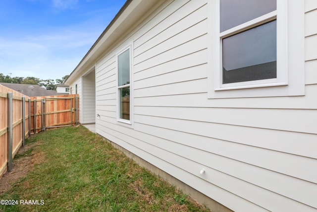 view of home's exterior featuring a yard