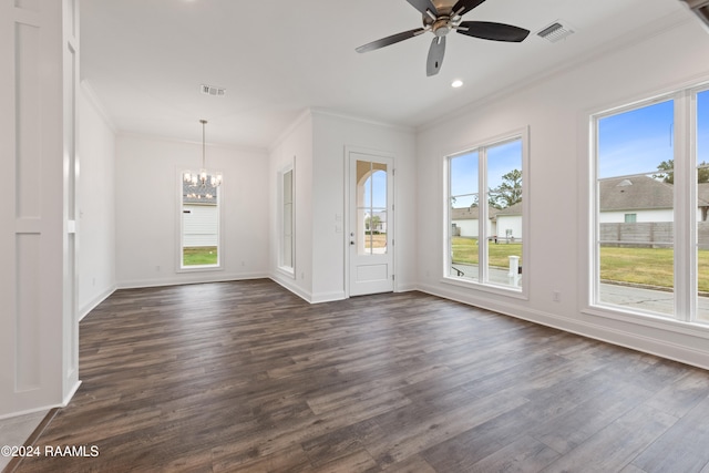 interior space with dark hardwood / wood-style flooring, ceiling fan with notable chandelier, and ornamental molding