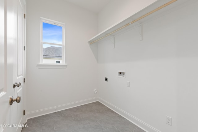 clothes washing area with tile patterned flooring, hookup for a washing machine, and hookup for an electric dryer