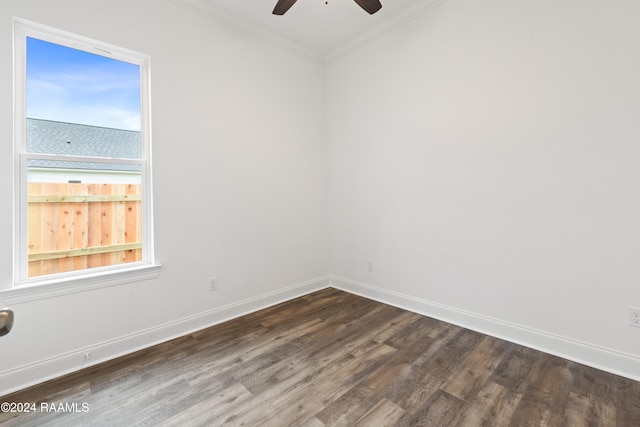 spare room featuring ceiling fan, ornamental molding, and dark hardwood / wood-style flooring