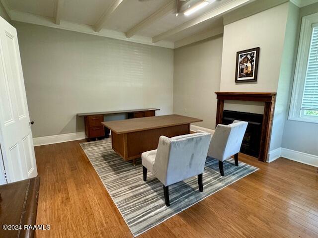 home office featuring hardwood / wood-style flooring and beam ceiling