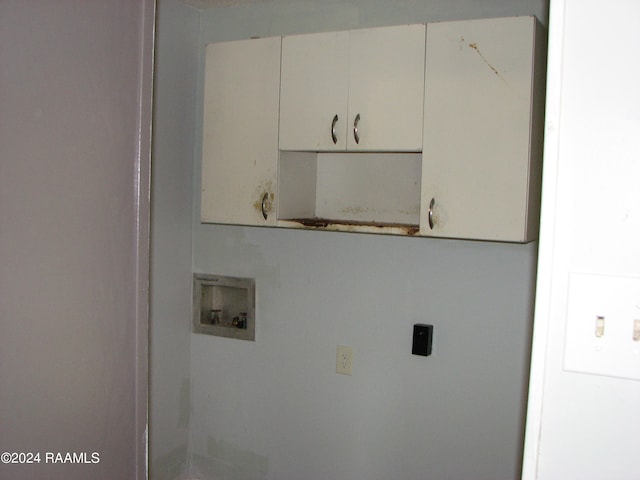 washroom featuring cabinets and hookup for a washing machine