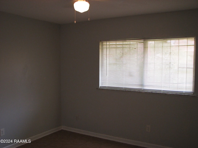 empty room with tile patterned flooring