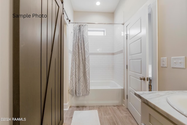 bathroom with vanity and shower / bathtub combination with curtain