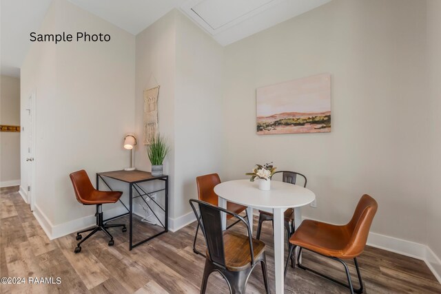 dining area with hardwood / wood-style flooring